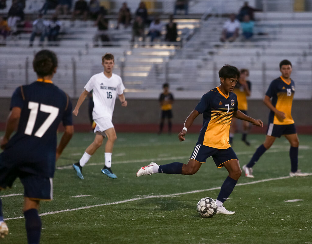Battle sophomore Mung Kim prepares to take a shot